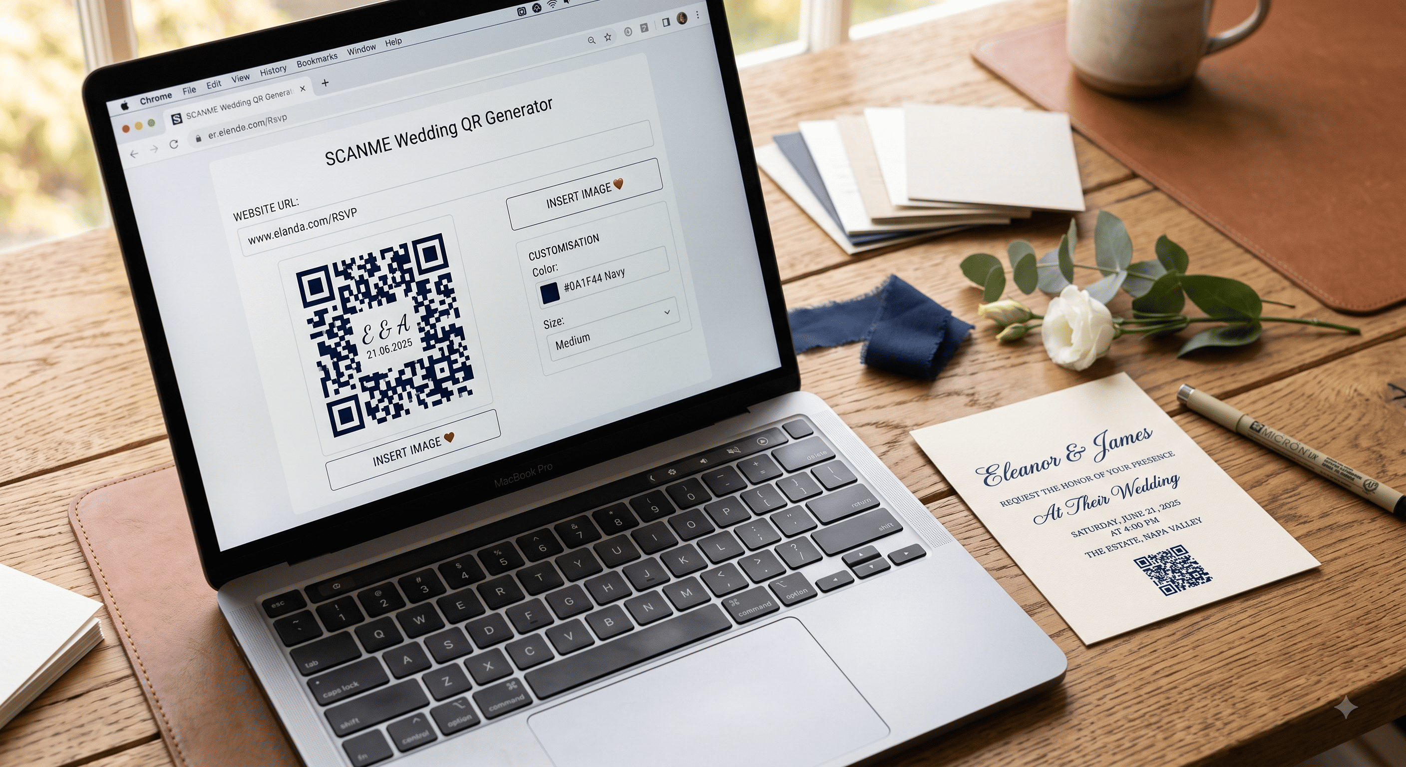 A laptop showing a QR code generator beside a printed proof of a wedding details card on a wooden desk.